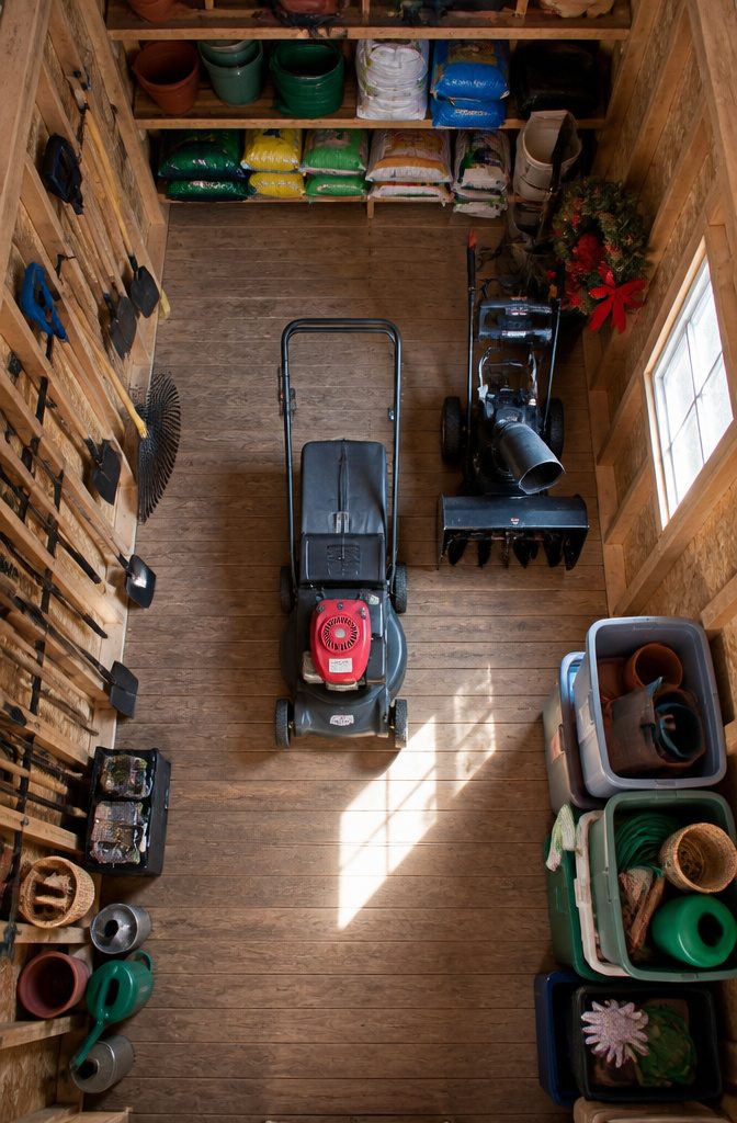 6 Ideas for Your 10x20 Shed Interior: Storage, Layout, and Use 1 Interior of a 10x20 shed filled with various lawn equipment and storage.