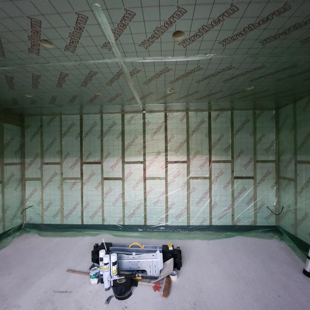 8 Book Shed Ideas for Shelves, Nooks and Hidden Doors 4 Insulated walls and ceiling of a small shed being constructed with green Xtratherm panels.