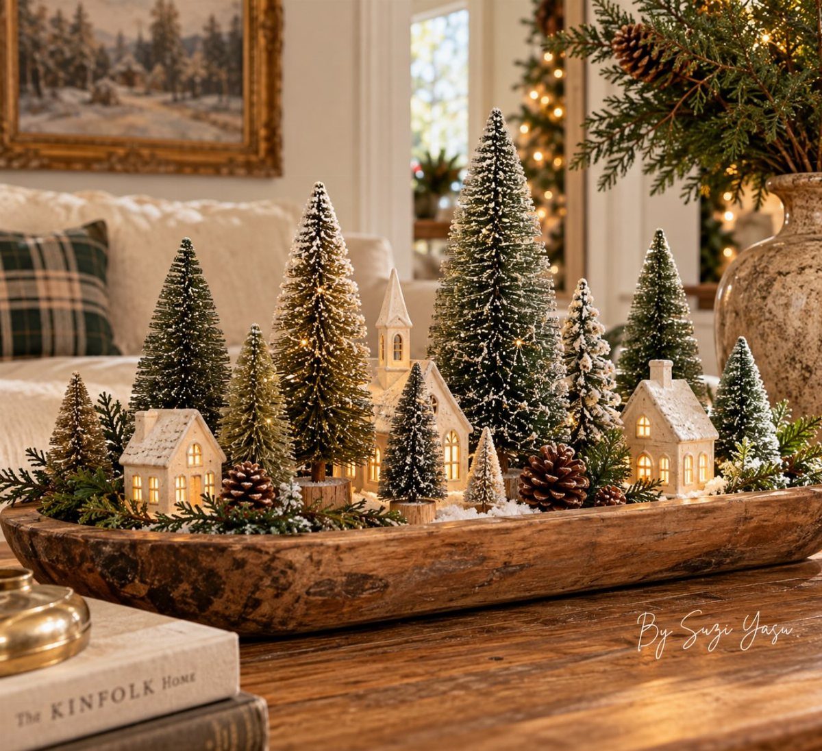 Christmas Table Centerpieces: 8 Ideas for Holiday Tables 3 Miniature snow-covered trees and glowing houses arranged inside a rustic wooden dough bowl.