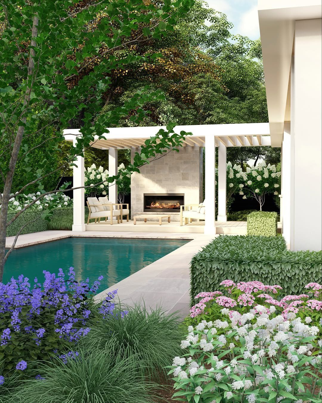 Modern white pergola with a built-in fireplace and lounge seating next to a swimming pool.