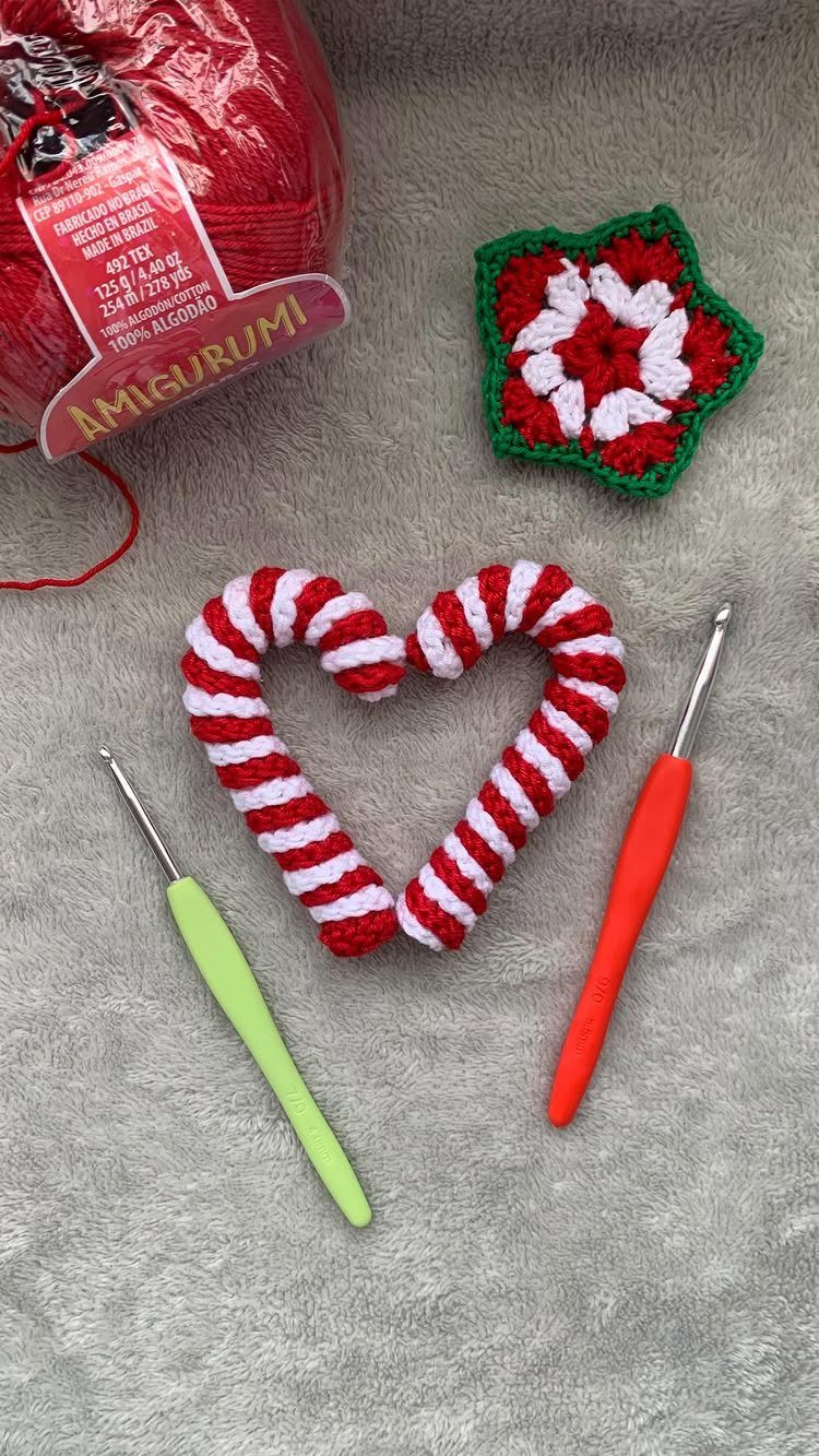 Crochet Christmas Ornaments: 19 Free Patterns for 2026 6 Red and white striped crochet candy cane ornament with crochet hooks and red yarn.