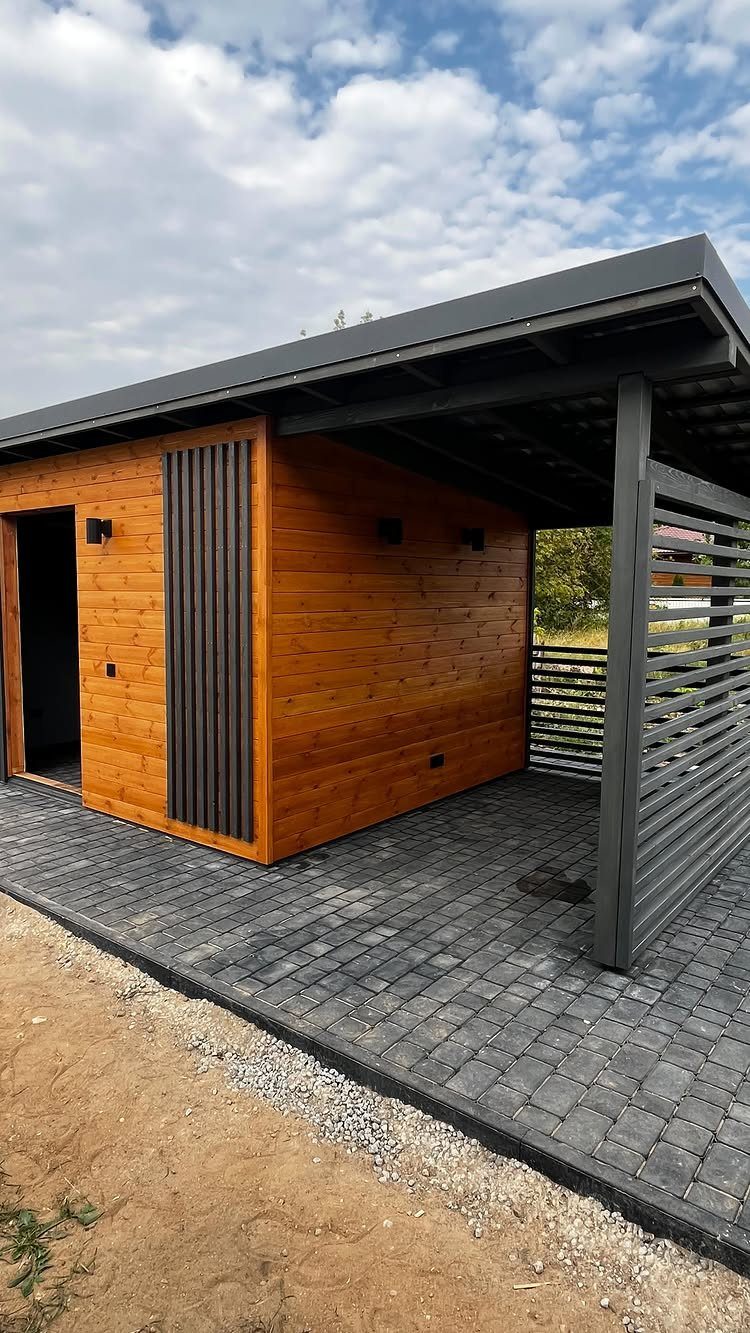 DIY Modern Shed: 19 Plans for Every Yard and Budget 16 Modern wooden shed with a flat roof and an integrated covered patio area.