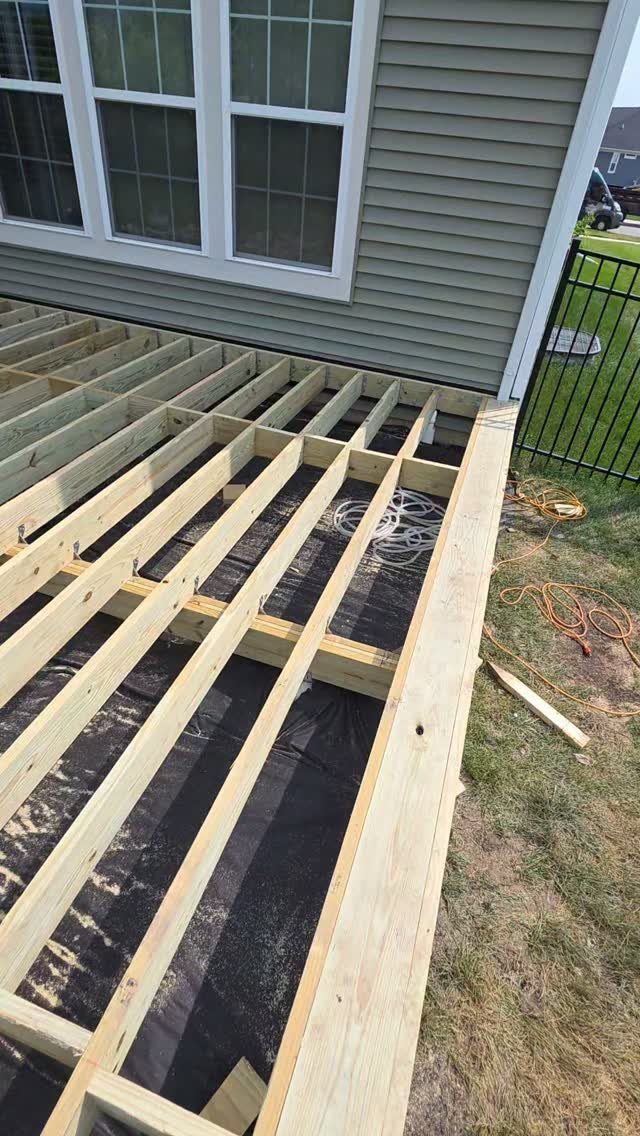 Raised Deck Frame: 8 Ideas From Wood Joists to Galvanized Steel 4 Wooden deck joists being installed as part of a new raised deck frame structure.